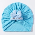 Detail of light blue baby turban hat with bow and embroidered sleeping eyes - Blue