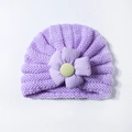 Close-up of purple knit baby turban hat featuring a large 3D fabric flower detail - Purple