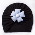 Detail of baby turban hat featuring a 3D blue fabric flower and waffle knit texture - Black