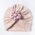 Detailed view of pink plush baby turban hat featuring a large decorative dotted flower - Nude Pink