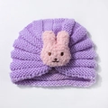 Detailed macro view of purple ribbed knit infant turban hat with plush bunny decor - Purple