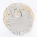 Detail of light gray baby bib with ruffled edges and matching bow headband set - Gray