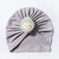 Detail of baby waffle knit hat in light purple with a cute plush avocado doll decoration - Gray