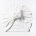 Detail of baby white pleated beanie featuring a cute plush bunny embroidery - White