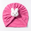 Detail of pink baby turban hat featuring a 3D plush bunny and pleated knit fabric texture - Rose Red