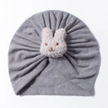 Close-up of grey knit baby turban hat featuring a 3D plush bunny patch detail - Gray