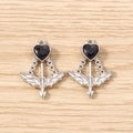 Detailed macro of two gothic silver heart pendants with black gems on wood background - 5 Pieces / Silver Black