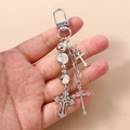 Detail showing silver beaded keychain with rhinestone crosses and metal lobster clasp - Silver Round Plate Cross