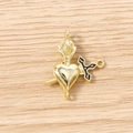 Macro detail of gold-plated heart and dagger charm connector with black enamel for DIY jewelry - 5 Pieces / Gold