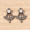Macro shot of Cupid's arrow heart pendants with black plating and clear zircon stone - 5 Pieces / Black & White