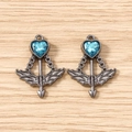 Detailed view of cupid arrow heart pendants with blue crystals and gun black finish - 5 Pieces / Black and Blue