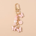 Portachiavi con farfalla rosa, ciondolo con lettera H dorata e perle a cuore - Lettera Farfalla