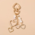 Detail of gold heart keychain with rhinestones, pearls, and a Love You pendant - Pearl Heart Keychain