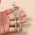 Portachiavi boho con perline turchesi, ciondolo a loto e pendente sole in argento antico - Fiore Turchese