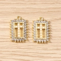 Close-up of gold rectangular pendants featuring pearl crosses and sparkling zircons - Gold Pearl