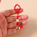Detailed strawberry beaded keychain with heart clasp held in hand for size visualization - Heart Strawberry Beaded