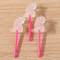 Detailed view of resin dinosaur lollipop charms with pink glitter and metal hooks - 10 Pieces Pack / White
