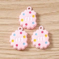 Detailed macro view of pink resin cookie charms with white m letter for DIY jewelry making - 10 Pieces Pack / Pink