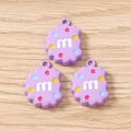 Detailed macro view of three purple resin cookie charms with m-letter and colorful dots - 10 Pieces Pack / Purple