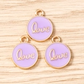 Macro detail of round purple enamel Love charms with gold metal edges for DIY jewelry - LOVE Letter Round Tag (3206) / 10 Pieces Pack / Purple