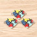Tre ciondoli a cuore con smalto colorato a puzzle per creazione di gioielli per l'autismo - Cuore Puzzle