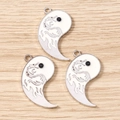 Macro detail of three silver dragon engraved Tai Chi pendants on light wood background - 10 Pieces Pack / Silver White