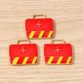Detailed macro view of red first aid kit charms with white cross for DIY jewelry making - Fire Bag / 10 Pieces Pack