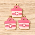 Gros plan de pendentifs trousse de secours en émail rose avec bordure dorée pour bijoux DIY - Lot de 10 / Rose
