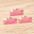 Detailed macro view of three pink cowgirl enamel charms with tiny white flower for DIY jewelry - Cowboy Sign Tag / 10 Pieces Pack / Pink