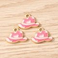 Macro detail of three pink and gold enamel cowboy hat charms on a wood surface - Cowboy Hat / 10 Pieces Pack / Pink