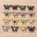 Set mit 16 Schmetterlingsanhängern mit herzförmigen Strasssteinen in Gold, Silber und Schwarz - Mehrfarbig