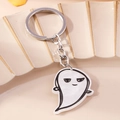 Cute ghost keychain with white marble acrylic pattern and silver chain on ceramic tray - Ghost