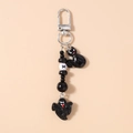 Detail of Halloween keychain featuring black cat and ghost charms with beaded chain - Beaded Ghost