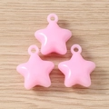 Close-up of three pink star charms with hooks on a natural wood surface for DIY jewelry - 5 Pieces / Pink