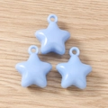 Macro shot of three light blue star pendants for DIY jewelry making on wood texture - 5 Pieces / Blue