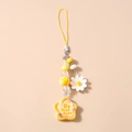 Detail of yellow beaded phone strap with daisy charm and star slogan pendant - Yellow Flower