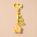 Detail of yellow beaded keychain with bear charm and 'Be Your Best' star pendant - Be Your Best (1906) / Yellow