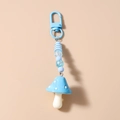 Blauwe paddenstoel sleutelhanger met gestreepte kralen en metalen D-ring sluiting - Blauw