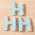 Detail view of 3 translucent blue resin letter H pendants with iridescent glitter and silver loops - 5 Pieces / Letter H