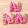 Close-up of three pink resin letter N pendants with glitter for DIY jewelry making - 5 Pieces / Letter N