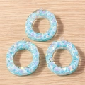 Close-up of three iridescent blue petal resin pendants with silver metal hooks for DIY - 5 Pieces / Letter O
