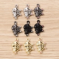 Gothic skull and spider web charms set in silver, gold, and gunmetal for DIY jewelry - 5 Pieces / Multicolor