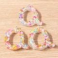 Close-up of letter Q macaron style pendant with colorful glitter for DIY crafts - 5 Pieces / Letter Q