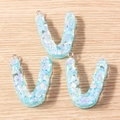 Close-up of translucent blue U-letter resin charms with colorful glitter and silver loops - 5 Pieces / Letter V