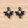 Detailed macro view of gothic black bat wing heart charms with purple gems on wood surface - 5 Pieces / Black Purple