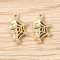 Macro detail of gold skull and spider web charms with sparkling white rhinestones - 5 Pieces / Gold White