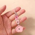 Close-up of pink flower charm with smiley face on plastic chain and silver lobster clasp - Flower Shape / Pink