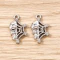 Close-up of silver skull spider web pendants with sparkling rhinestones for jewelry making - 5 Pieces / Silver