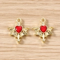Macro detail of red heart wing charms with gold alloy base and Cupid arrow for DIY jewelry - 5 Pieces / Gold Red