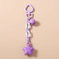 Détail du porte-clés étoile violette avec fermoir coeur, chaîne en plastique et clochette - Violet